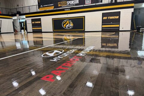 A gymnasium floor displays the Hyundai logo and Patriot Hyundai